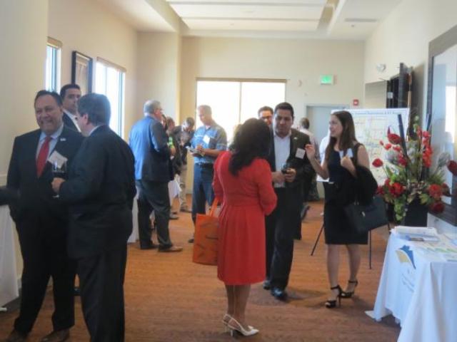 Attendees mingling in hallway